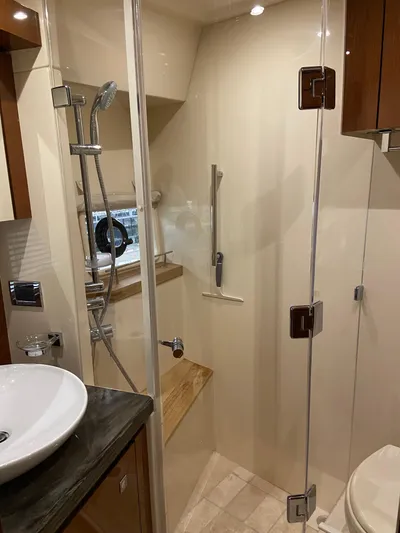 Yonder Star Yacht Photos Pics Luxurious bathroom in 2016 Sea Ray 510 Fly yacht with modern shower and sink.