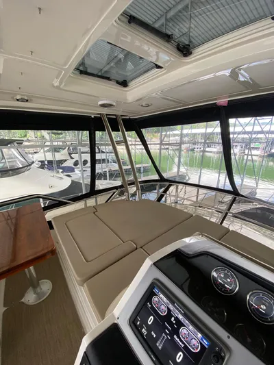 Yonder Star Yacht Photos Pics Interior view of 2016 Sea Ray 510 Fly yacht with dashboard and seating area.