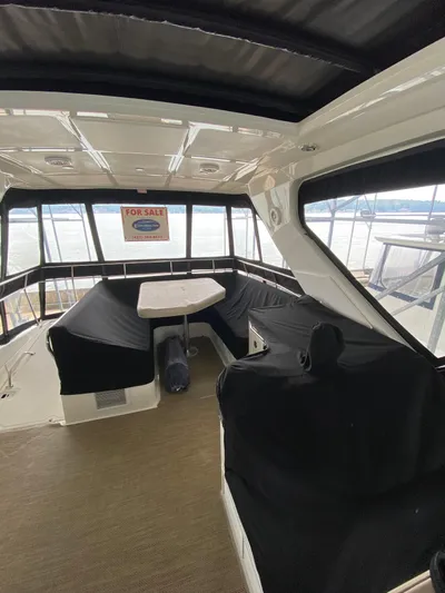 Yonder Star Yacht Photos Pics 2016 Sea Ray 510 Fly yacht interior with seating, table, and "For Sale" sign.