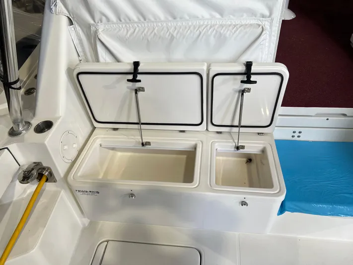  Yacht Photos Pics 2011 Rampage 41 Express boat with open storage compartments on deck.