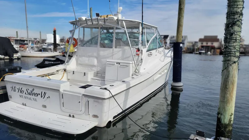  Yacht Photos Pics 2011 Rampage 41 Express boat docked in marina, rear view.