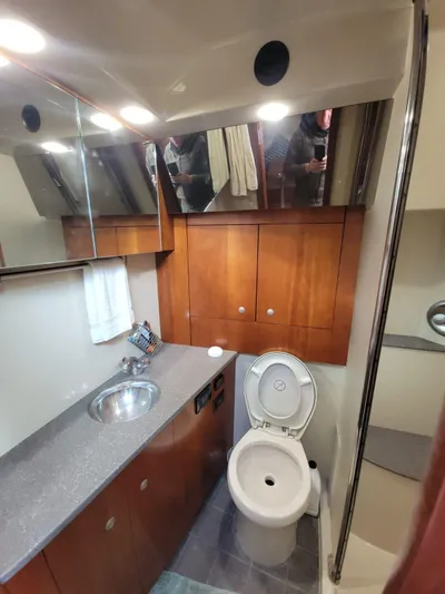  Yacht Photos Pics 2011 Rampage 41 Express yacht bathroom with wooden cabinets and modern fixtures.