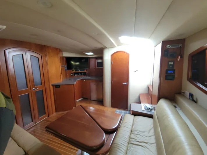  Yacht Photos Pics Interior of 2011 Rampage 41 Express yacht with wood finishes and modern amenities.