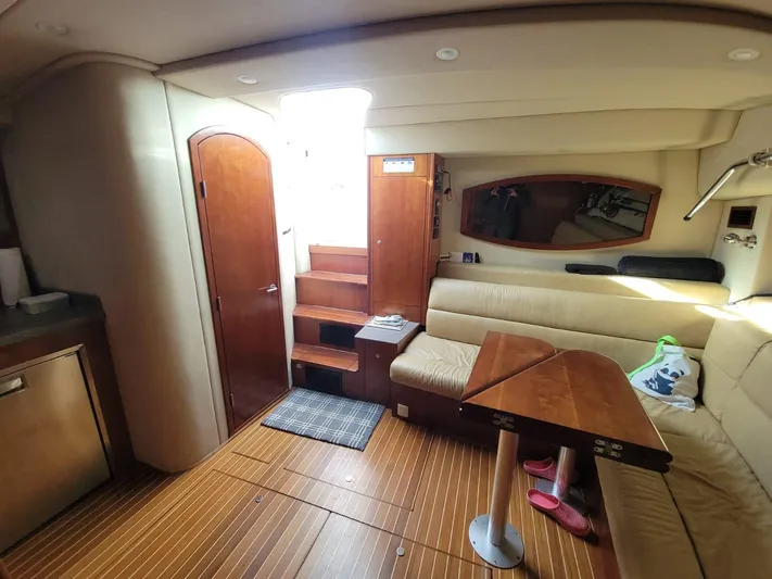  Yacht Photos Pics Interior of 2011 Rampage 41 Express yacht with wooden flooring and beige seating.