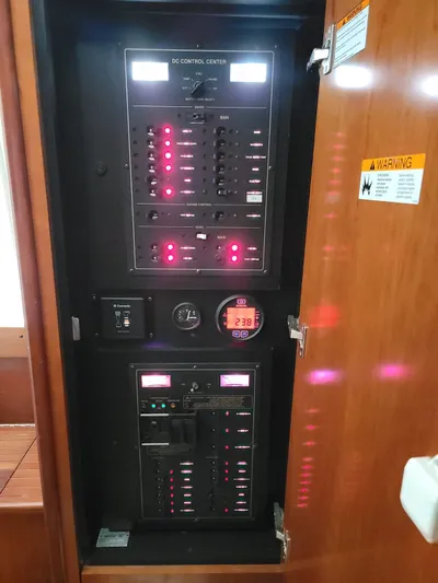  Yacht Photos Pics Electrical control panel inside 2011 Rampage 41 Express boat, featuring illuminated switches and gauges.