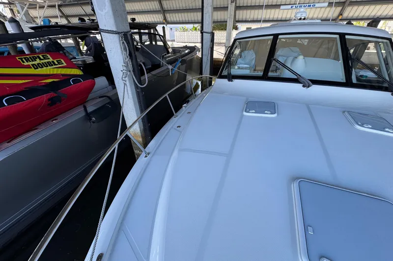 Regalo Yacht Photos Pics 2013 Cabo 44 Hardtop Express yacht docked in marina, side view.