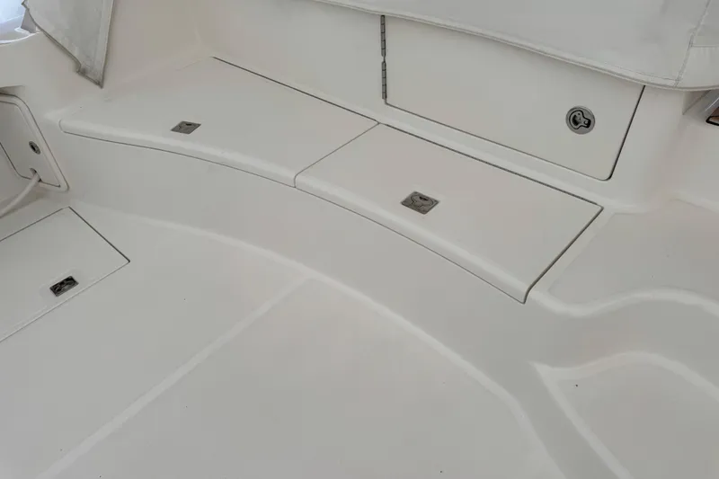 Regalo Yacht Photos Pics 2013 Cabo 44 Hardtop Express boat deck with storage compartments.