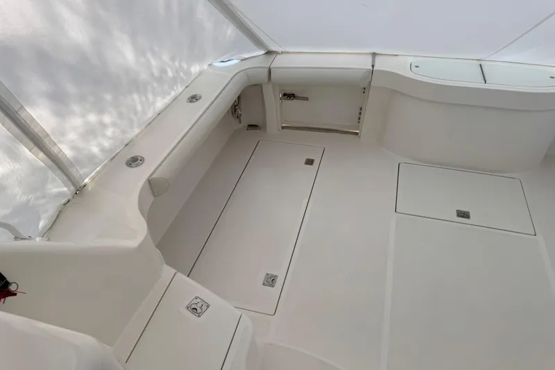 Regalo Yacht Photos Pics 2013 Cabo 44 Hardtop Express boat interior with white seating and storage compartments.