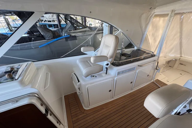 Regalo Yacht Photos Pics 2013 Cabo 44 Hardtop Express interior with helm seat and sleek design.