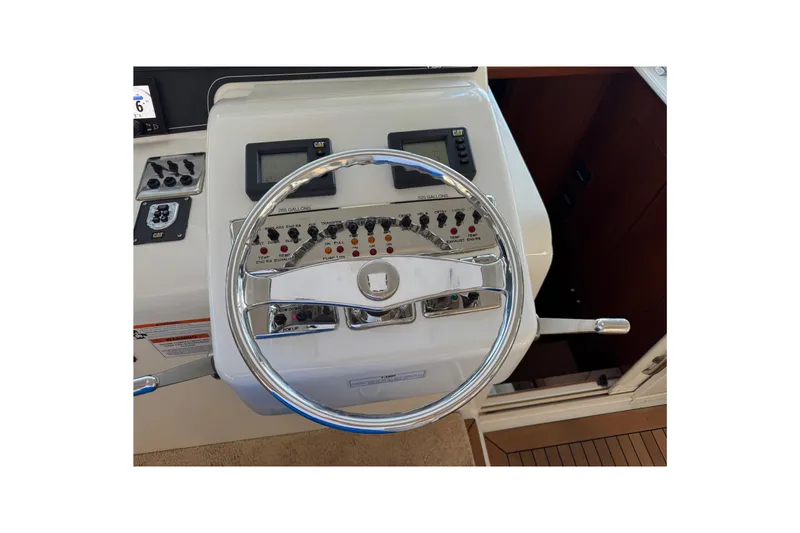 Regalo Yacht Photos Pics Steering wheel and controls of 2013 Cabo 44 Hardtop Express yacht.