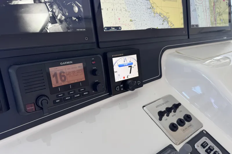 Regalo Yacht Photos Pics Control panel of 2013 Cabo 44 Hardtop Express with navigation and communication systems.