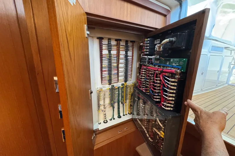 Regalo Yacht Photos Pics Electrical panel inside 2013 Cabo 44 Hardtop Express yacht, showcasing wiring and components.