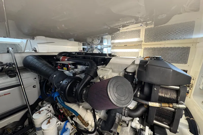 Regalo Yacht Photos Pics Engine room of 2013 Cabo 44 Hardtop Express, showcasing detailed mechanical components.