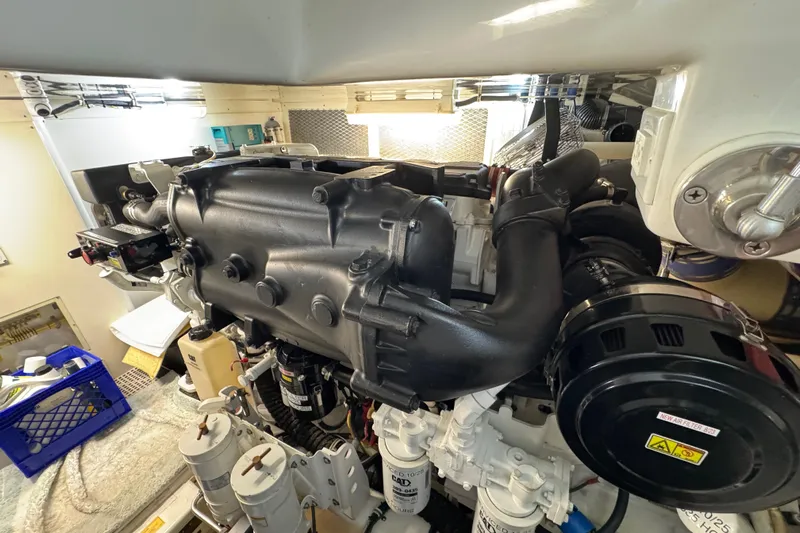 Regalo Yacht Photos Pics Engine room of 2013 Cabo 44 Hardtop Express yacht, showcasing detailed machinery.
