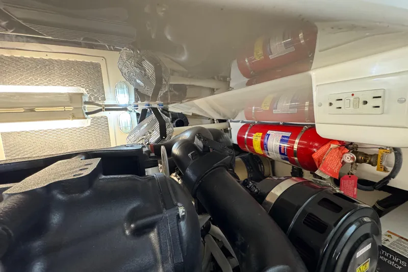 Regalo Yacht Photos Pics Engine room of 2013 Cabo 44 Hardtop Express with fire extinguishers and ventilation fans.