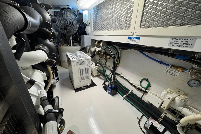 Regalo Yacht Photos Pics Engine room of 2013 Cabo 44 Hardtop Express with machinery and wiring.