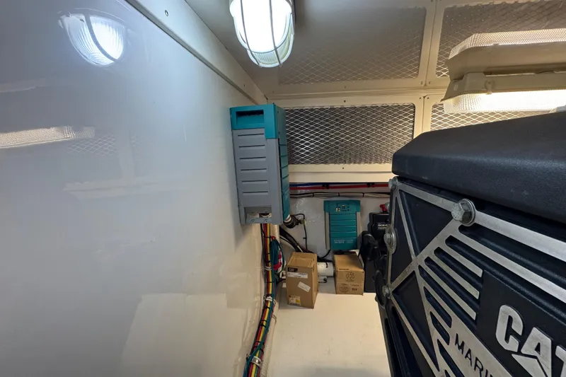 Regalo Yacht Photos Pics Engine room of 2013 Cabo 44 Hardtop Express with electrical equipment and wiring.