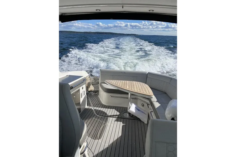  Yacht Photos Pics 2020 Sea Ray Sundancer 320 cruising on open water, view from the deck.