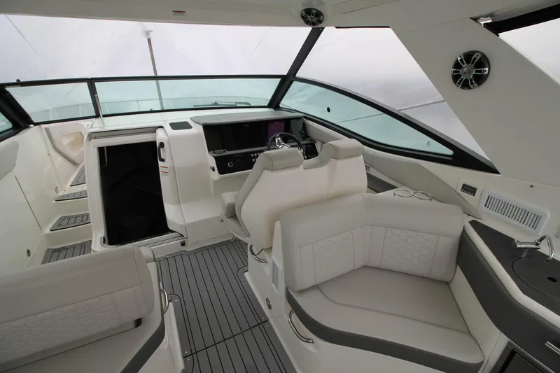  Yacht Photos Pics 2020 Sea Ray Sundancer 320 interior with modern helm and luxurious seating.