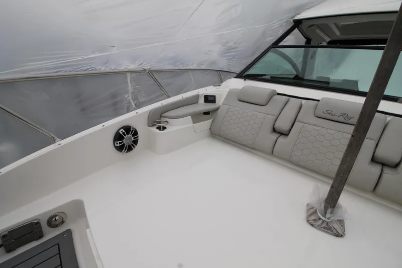  Yacht Photos Pics 2020 Sea Ray Sundancer 320 interior with cushioned seating and modern design.