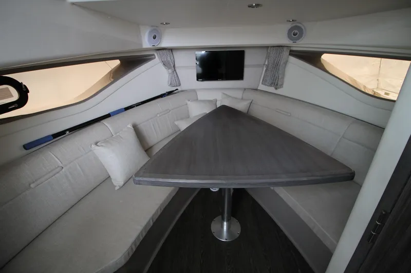  Yacht Photos Pics 2020 Sea Ray Sundancer 320 interior with sleek seating and modern table design.