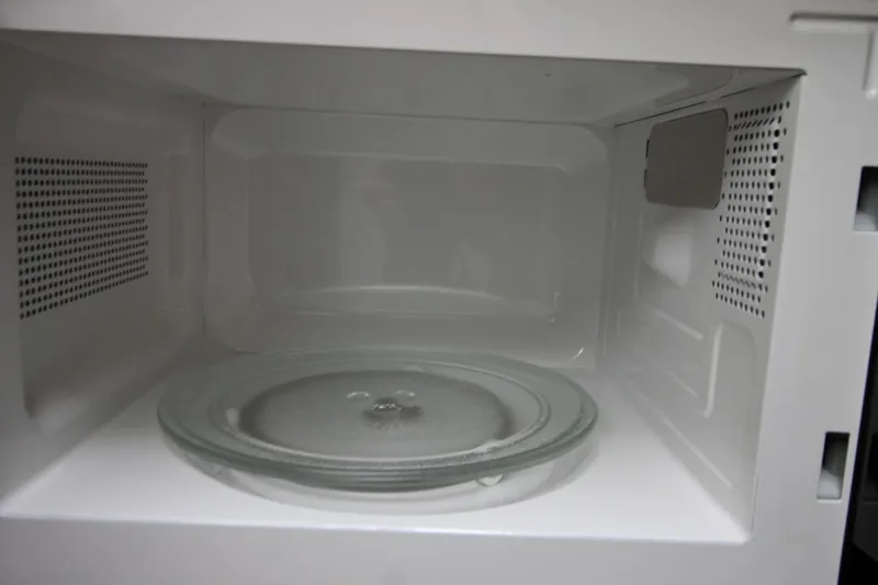  Yacht Photos Pics Empty microwave interior with glass turntable, clean and ready for use.