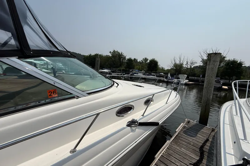  Yacht Photos Pics 2003 Sea Ray 340 Sundancer docked at a marina, side view.