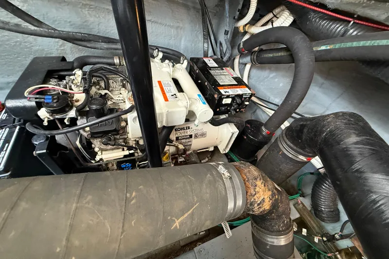  Yacht Photos Pics Engine compartment of 2003 Sea Ray 340 Sundancer with Kohler power system and hoses.