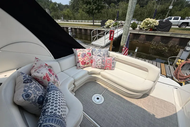  Yacht Photos Pics 2003 Sea Ray 340 Sundancer boat interior with floral cushions, docked by a canal.