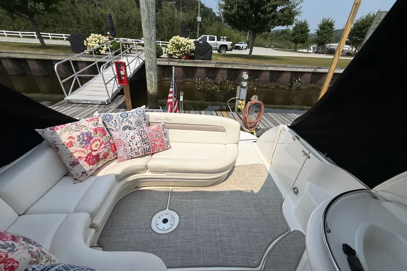  Yacht Photos Pics 2003 Sea Ray 340 Sundancer boat interior with floral cushions at a dock.