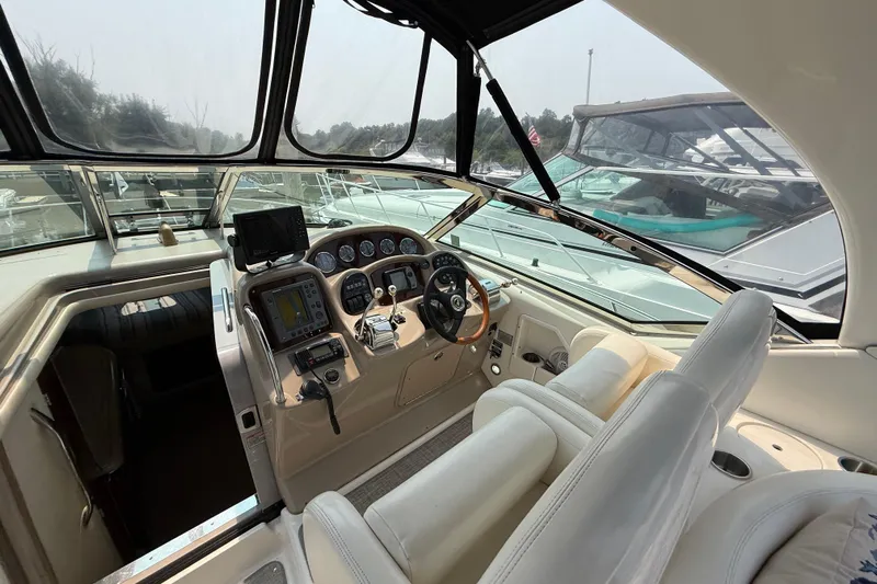  Yacht Photos Pics 2003 Sea Ray 340 Sundancer helm with modern navigation equipment and comfortable seating.