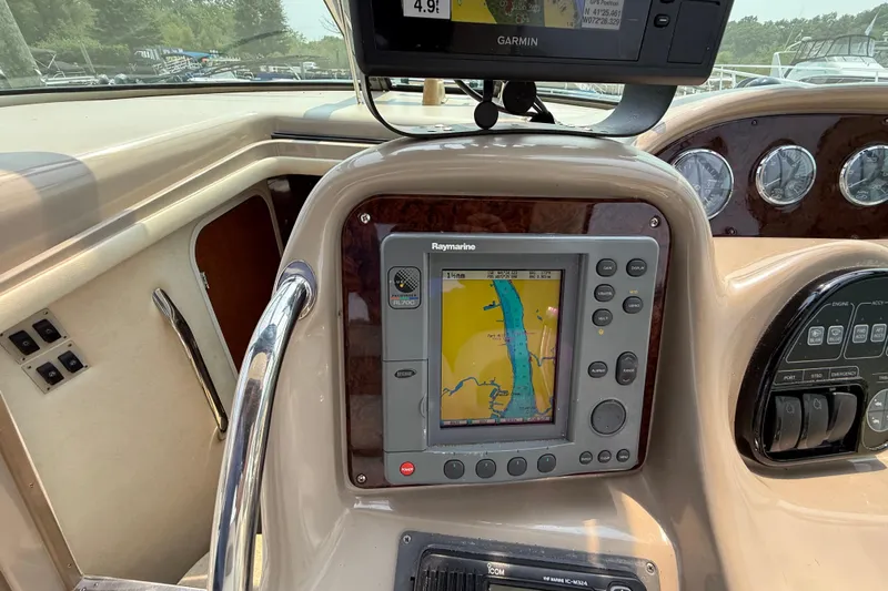  Yacht Photos Pics Control panel of a 2003 Sea Ray 340 Sundancer with navigation system and gauges.