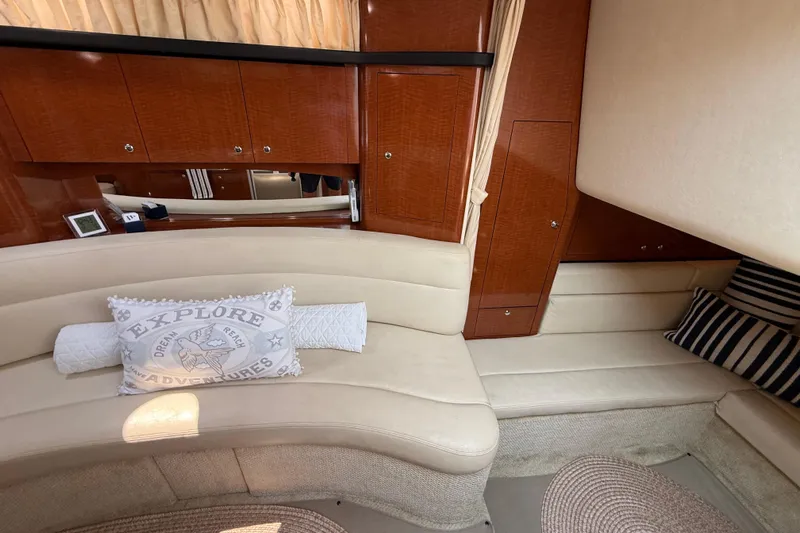  Yacht Photos Pics 2003 Sea Ray 340 Sundancer interior with beige seating and decorative pillows.