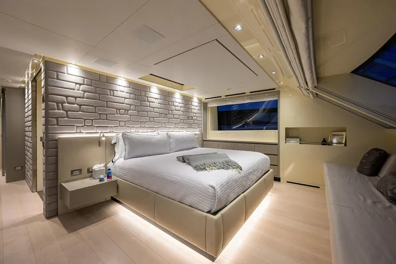 Phoenix Yacht Photos Pics Luxurious bedroom interior of 2019 Sanlorenzo SD112 yacht with modern design and ambient lighting.