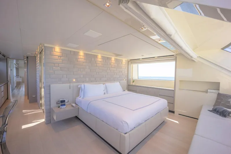 Phoenix Yacht Photos Pics Luxurious bedroom interior on 2019 Sanlorenzo SD112 yacht, featuring modern design and ocean view.