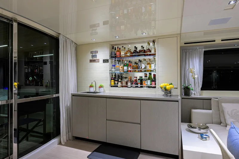 Phoenix Yacht Photos Pics Luxurious interior of 2019 Sanlorenzo SD112 yacht with elegant bar and modern decor.