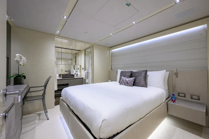 Phoenix Yacht Photos Pics Luxurious bedroom interior on 2019 Sanlorenzo SD112 yacht, featuring modern design and elegant decor.