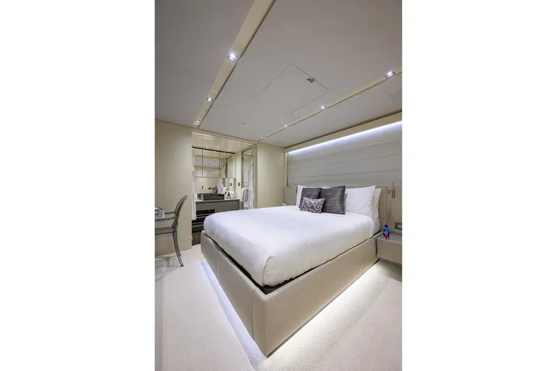 Phoenix Yacht Photos Pics Luxurious bedroom interior on 2019 Sanlorenzo SD112 yacht, featuring modern design and ambient lighting.