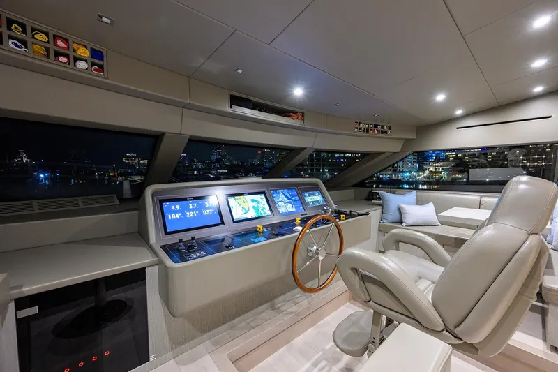 Phoenix Yacht Photos Pics Luxurious 2019 Sanlorenzo SD112 yacht helm with modern navigation displays and plush seating.