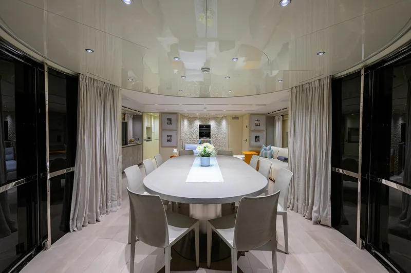 Phoenix Yacht Photos Pics Luxurious dining area on 2019 Sanlorenzo SD112 yacht, featuring elegant decor and modern furnishings.