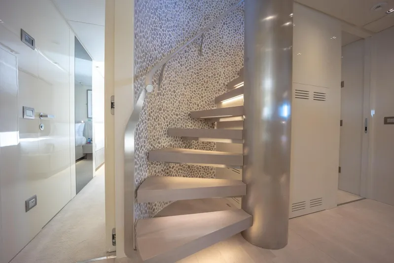 Phoenix Yacht Photos Pics Luxurious interior staircase on 2019 Sanlorenzo SD112 yacht, featuring modern design and elegant finishes.