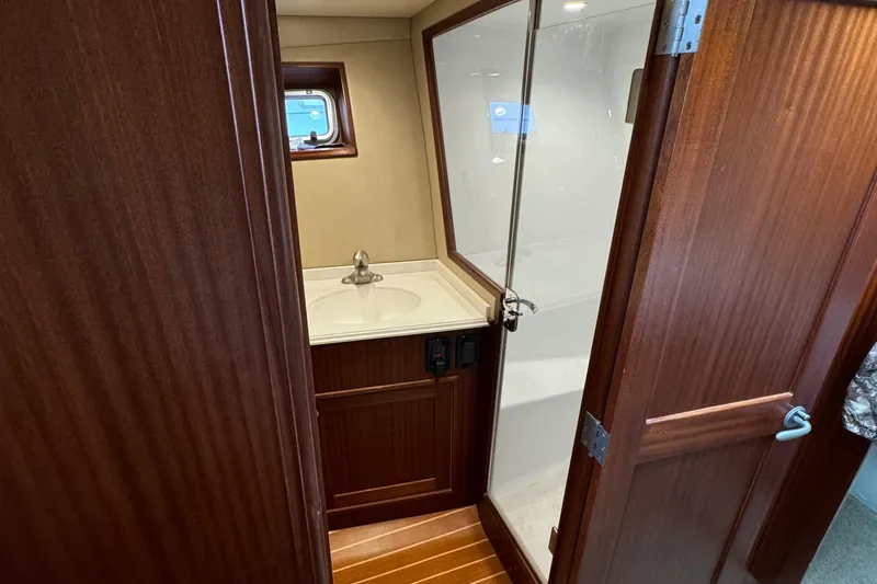 Thunder Yacht Photos Pics Custom Carolina 36 Warren O'Neal 1962 yacht bathroom with wood paneling and shower.