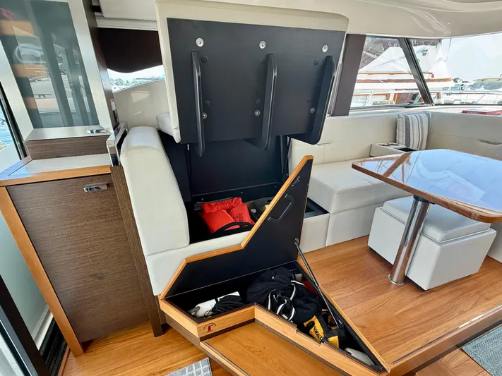  Yacht Photos Pics Interior of 2017 Tiara Yachts C44 Coupe with storage under seating.