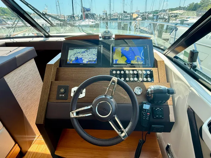  Yacht Photos Pics Helm of 2017 Tiara Yachts C44 Coupe with navigation screens and controls.