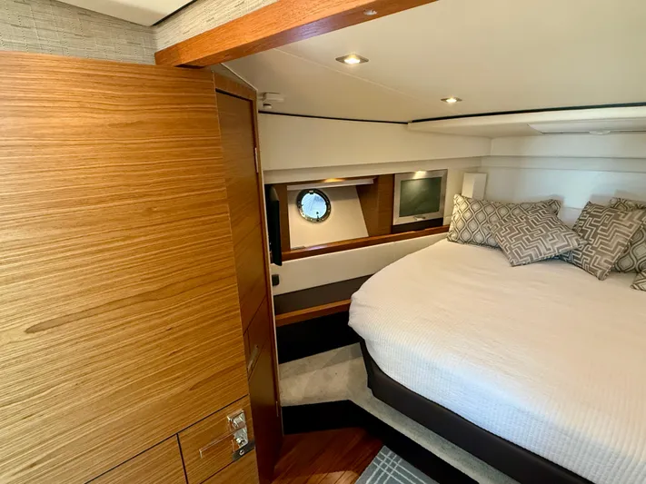  Yacht Photos Pics Luxurious bedroom interior of 2017 Tiara Yachts C44 Coupe with modern design and cozy bedding.