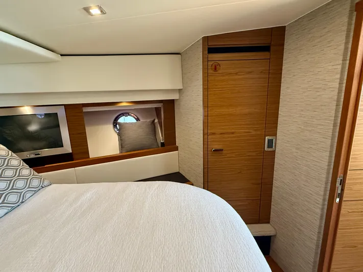  Yacht Photos Pics Luxurious interior of 2017 Tiara Yachts C44 Coupe with modern wood finishes.