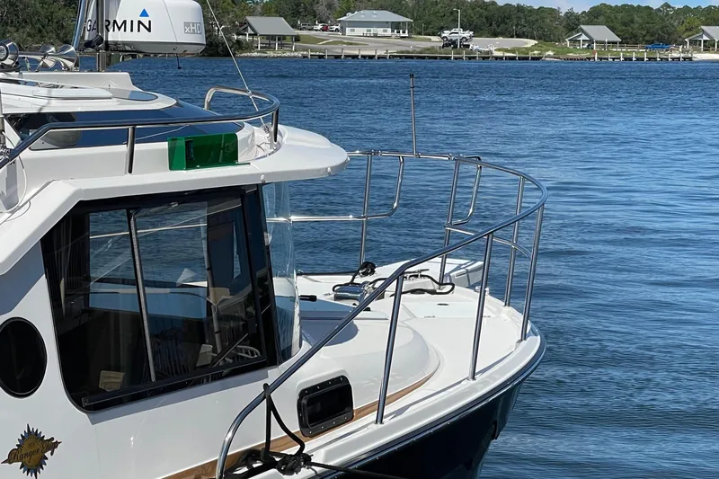  Yacht Photos Pics 2026 Ranger Tugs R-29 S boat docked on calm water, featuring sleek design and modern equipment.