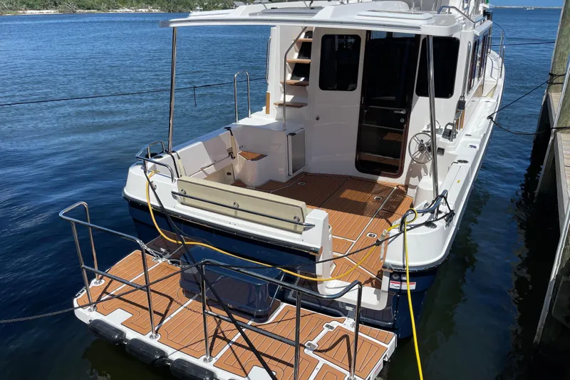  Yacht Photos Pics 2026 Ranger Tugs R-29 S docked, showcasing spacious deck and modern design.