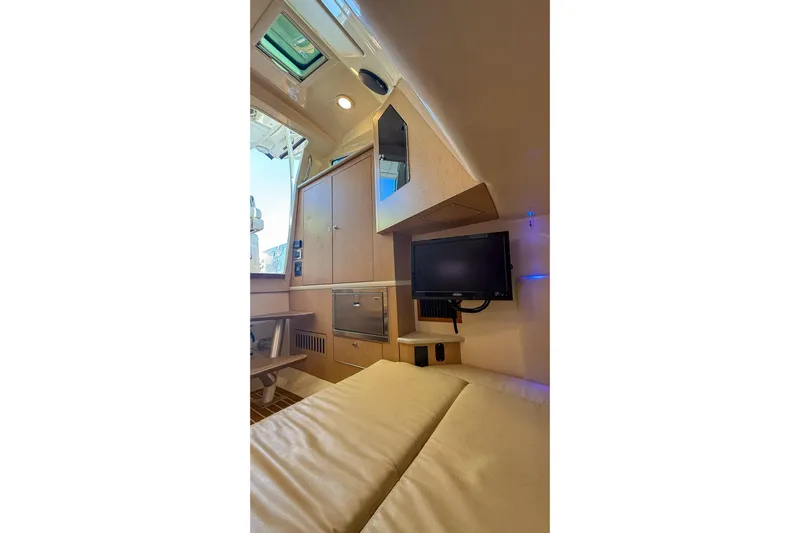  Yacht Photos Pics Interior cabin of 2017 Boston Whaler 370 Outrage with TV and seating area.