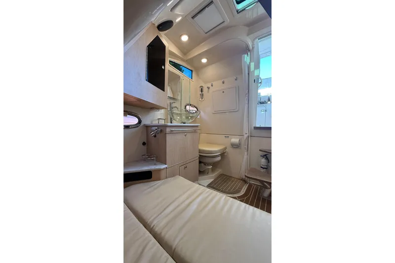  Yacht Photos Pics Interior of 2017 Boston Whaler 370 Outrage, featuring a compact bathroom with modern amenities.